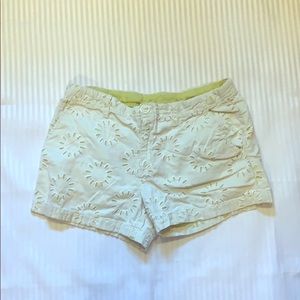 White and green shorts with threaded sun/flowers